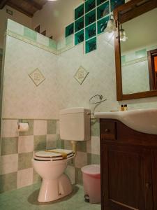 a bathroom with a toilet and a sink at B&B Villa Erika in Villa San Martino