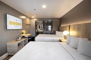 Tempat tidur dalam kamar di Oasis at Gold Spike