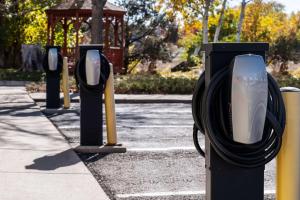 a row of parking meters in a parking lot at Hilton Fort Collins in Fort Collins