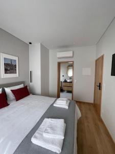 Katil atau katil-katil dalam bilik di OPORTO Suites