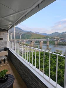 a balcony with a view of a river at Vistadouro in Peso da Régua