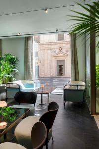 A seating area at Radisson Collection Hotel, Roma Antica