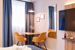 Televisi dan/atau pusat hiburan di XZLLENZ Traum Studio-Apartment, Frei-Parken, U-Bahn, Küche