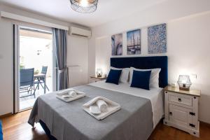 מיטה או מיטות בחדר ב-KG Acropolis Escape Spa Apartment