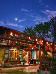 a building with a restaurant with lights on at Peace Home in Sa Pa