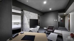 Gulta vai gultas numurā naktsmītnē Daiwa Roynet Hotel Nishi-Shinjuku PREMIER