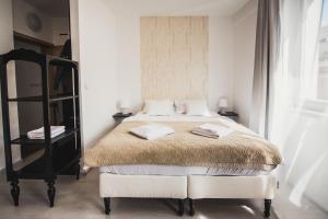 เตียงในห้องที่ ZARA LUXURY APARTMENTS The absolute center of Žilina