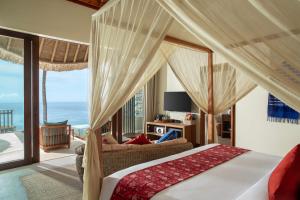 Tempat tidur dalam kamar di Kalandara Resort Lombok