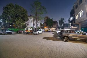 a parking lot with cars parked on a city street at Parnil Palace in Guwahati