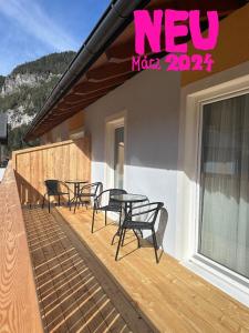 a group of chairs and tables on a deck at Zeffererhof in Schladming