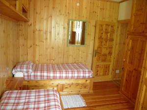 Una cama o camas en una habitación de Bormio Flat