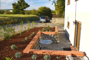 Um jardim em Charmanter Rückzugsort mit Großer Terrasse in Idyllischer Umgebung