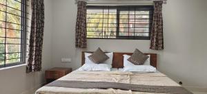 A bed or beds in a room at Sugamya Farm Guesthouse