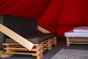 Una cama o camas en una habitación de Glamping Camp Faro