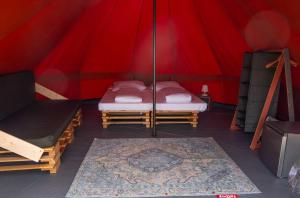 Una cama o camas en una habitación de Glamping Camp Faro