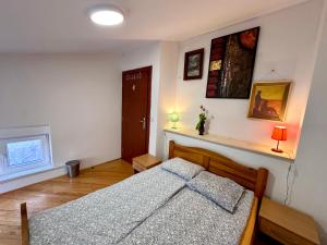 a bedroom with a bed and a window at Hostel Vagabond in Sarajevo