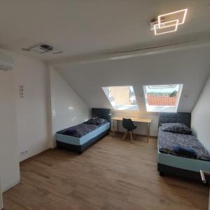 Ένα ή περισσότερα κρεβάτια σε δωμάτιο στο City Apartments Offenbach