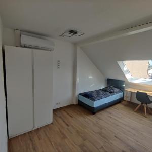 Ένα ή περισσότερα κρεβάτια σε δωμάτιο στο City Apartments Offenbach