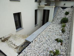 an external view of a building with a gravel yard at LUCKA BLED quiet location, free bikes, big garden, doctor in Bled