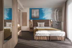 Tempat tidur dalam kamar di Stay! Hotel Boardinghouse