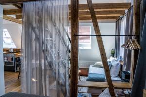 a bedroom with a bunk bed in a room at Besighomes Apartment Loft in Besigheim