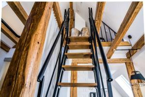 a staircase in a house with wooden beams at Besighomes Apartment Loft in Besigheim