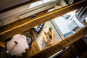 an overhead view of a room with a table and chairs at Besighomes Apartment Loft in Besigheim