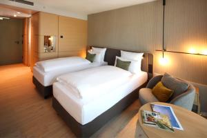 Cama ou camas em um quarto em ATLANTIC Hotel Heidelberg