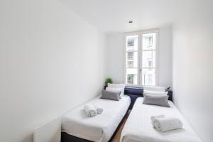 Cama ou camas em um quarto em Appartements Le 31bis