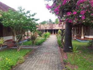 A garden outside Isola Di Cocco Ayurvedic Beach Resort