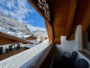 a view from the balcony of a house in the mountains at Cesa Planber Apartments Mountain View SKI-IN SKI-OUT in Canazei