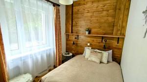 Lova arba lovos apgyvendinimo įstaigoje Muszynka Guest House