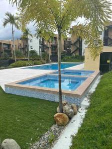 Piscina de la sau aproape de Hermoso apartamento de vacaciones en el Quindío