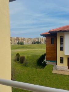 a view of a yard with a building at Luxury Lighthouse Golf Villa in Balchik