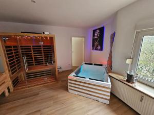 Krevet ili kreveti u jedinici u objektu L'Appart Spa, Jacuzzi & Sauna