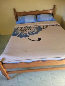 Cama ou camas em um quarto em Tim's & Mag's Home Stay