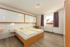 Cama ou camas em um quarto em Linz CITY