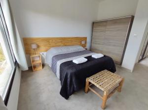 Una cama o camas en una habitación de El Algarrobo