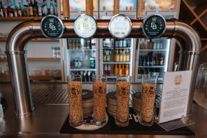 a counter with a bunch of bottles of dog food at Trail-Inn Natur & Sporthotel in Berdorf