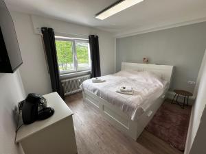 เตียงในห้องที่ Premium Apartments Schwetzingen, Heidelberg, Speyer