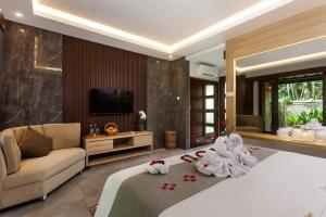 Teba Suci Suite and Villas में एक कमरे में एक या कई बेड