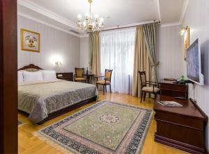 Krevet ili kreveti u jedinici u objektu Villa Stanislavskyi Hotel