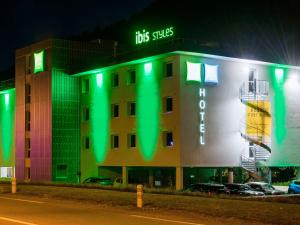 a building with green lights on the side of it at Ibis Styles Sallanches Pays du Mont-Blanc in Sallanches