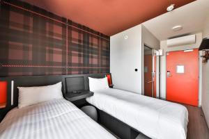 Vuode tai vuoteita majoituspaikassa easyHotel Paris Charles de Gaulle Villepinte