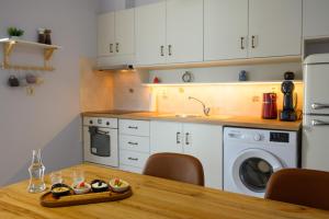 A kitchen or kitchenette at Elounda Luso Apartment