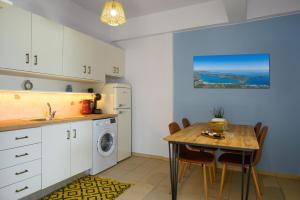 A kitchen or kitchenette at Elounda Luso Apartment