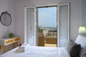 A bed or beds in a room at Elounda Luso Apartment