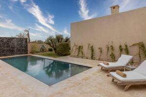 The swimming pool at or close to Ksar Char-Bagh Small Luxury Hotels