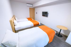 Krevet ili kreveti u jedinici u okviru objekta Hotel Sobial Namba Daikokucho