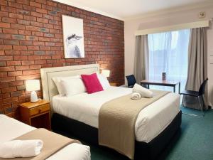 Кровать или кровати в номере City Heart Motel Warrnambool